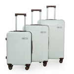 Set of three white suitcases with wheels on a white background