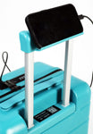 Turquoise suitcase with a phone on top and charging cable, on a white background