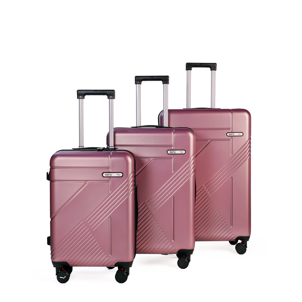 Set of three Rose gold suitcases with a white background