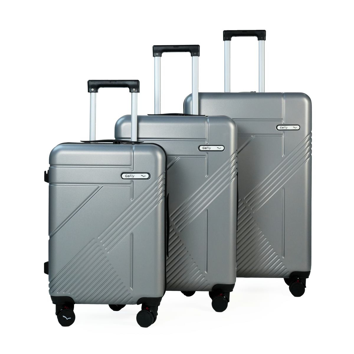 Set of three silver suitcases with wheels on a white background