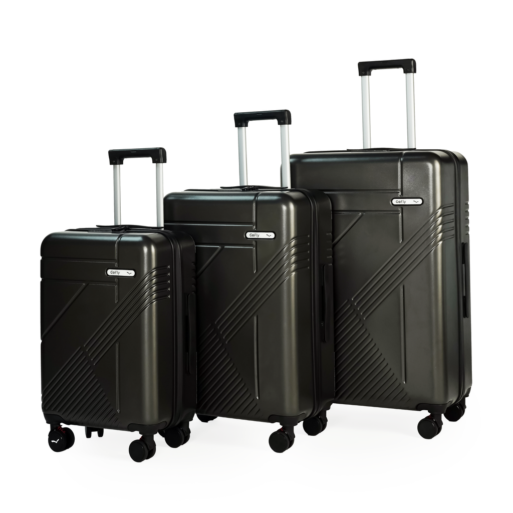 Set of three black suitcases of different sizes on a white background